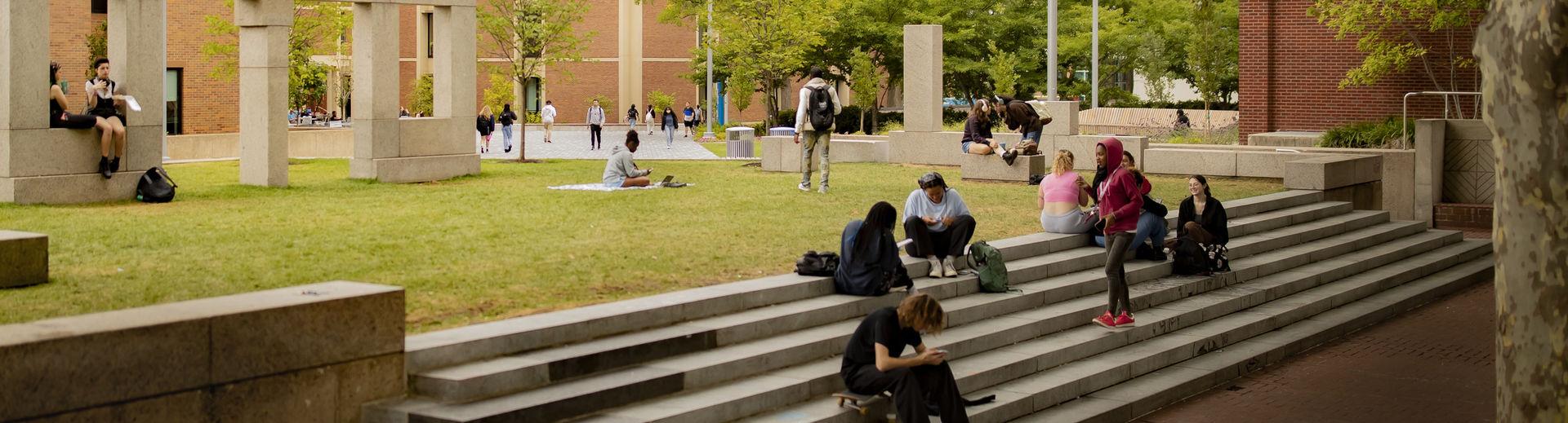 Students gather on a set of steps on Main Campus.